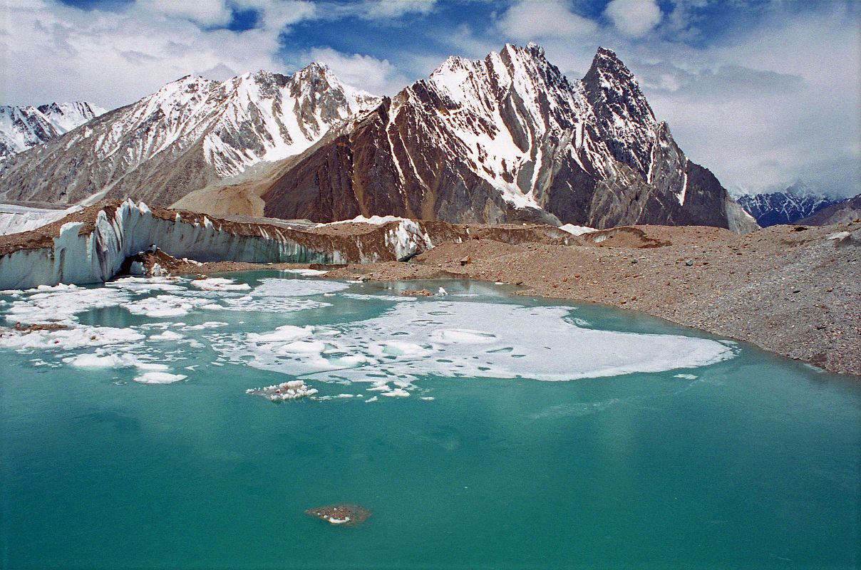 11 Green Glacial Lake On Upper Baltoro Glacier With Mitre Peak Behind There was a large green glacial lake on the Upper Baltoro Glacier with Mitre Peak behind, as we trekked towards Shagring Camp.